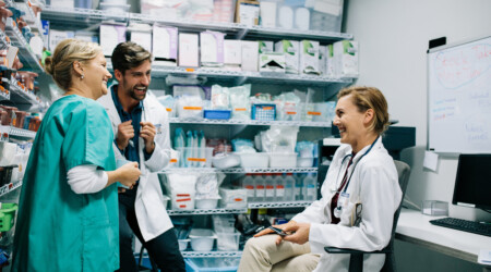 Hospital staff having casual discussion in the pharmacy