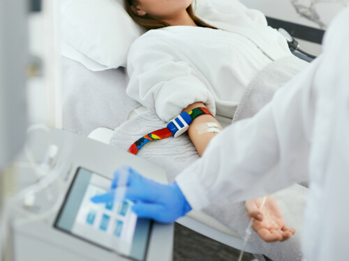 Blood Ozone Therapy. Woman At Blood Transfusion Treatment