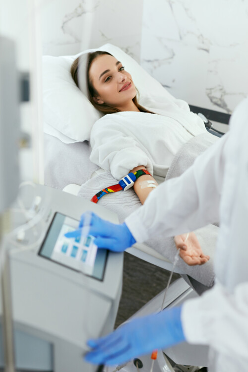 Blood Ozone Therapy. Woman At Blood Transfusion Treatment